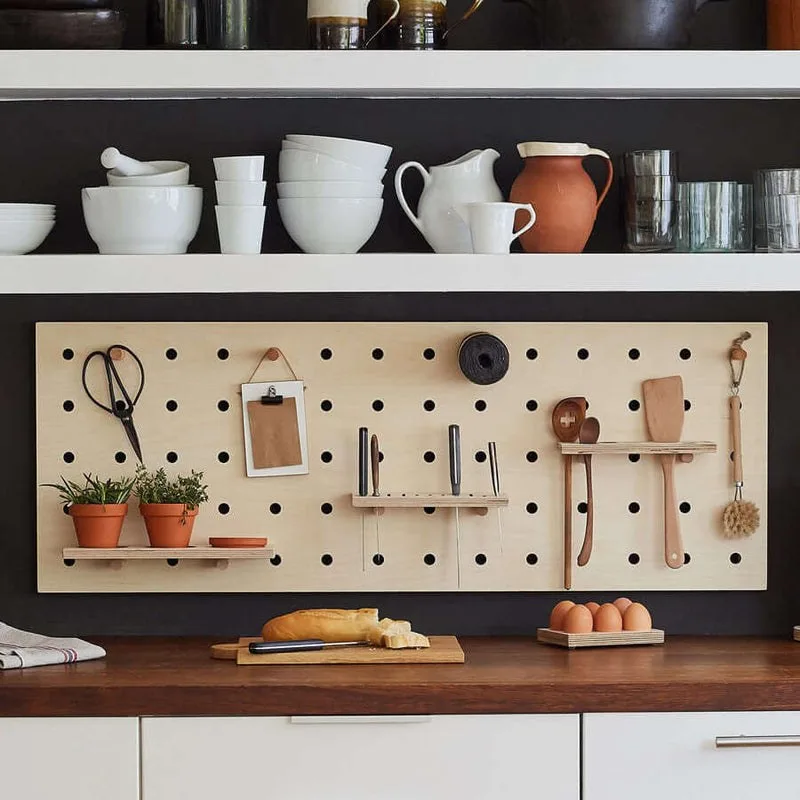 Kitchen pegboard with knife and utensil racks