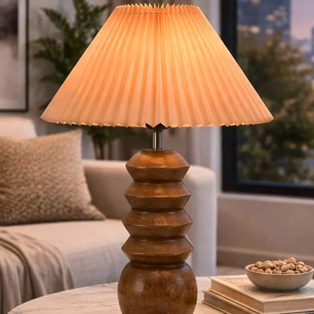 Stacked-turned wood table lamp with pleated shade