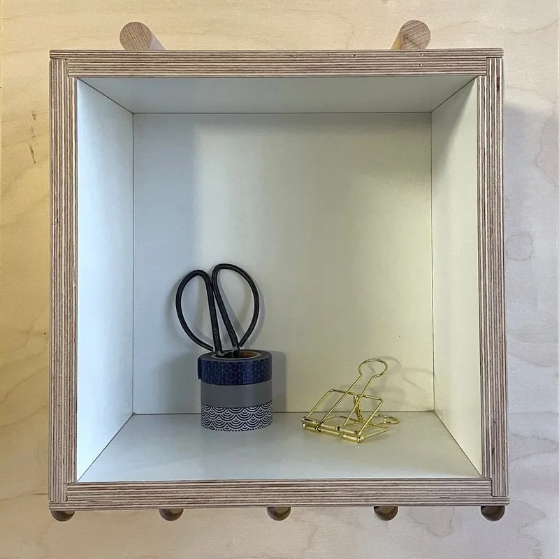 Large white plywood box for pegboards